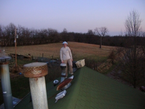 on the roof, installing a tubular skylight to get some natural light into the central bathroom